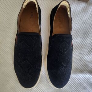 OluKai Black and White Flats Sleek Slip-On Design